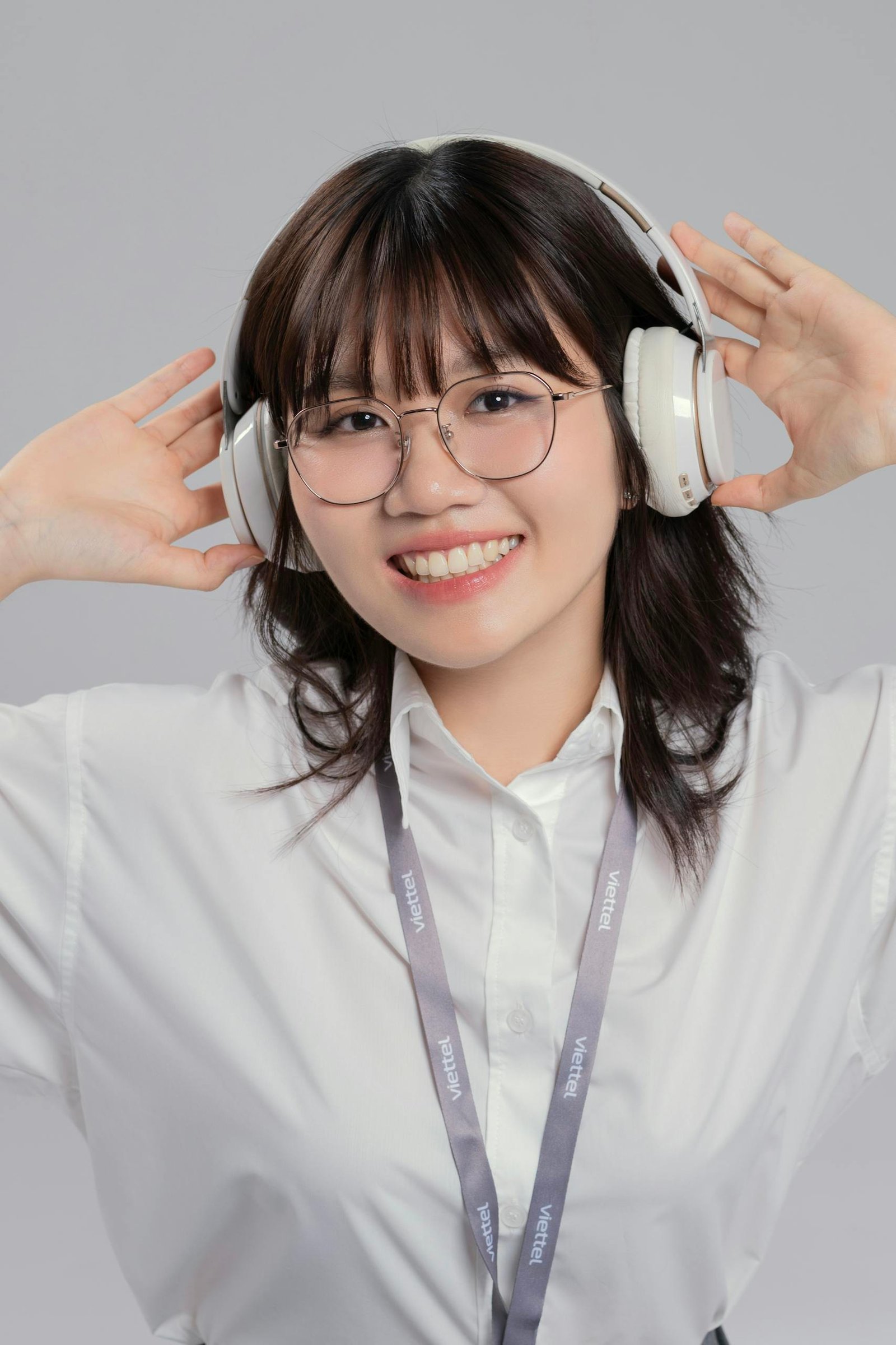 Smiling Woman Wearing Headphones and Glasses